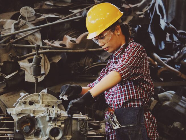 Woman repairing machine