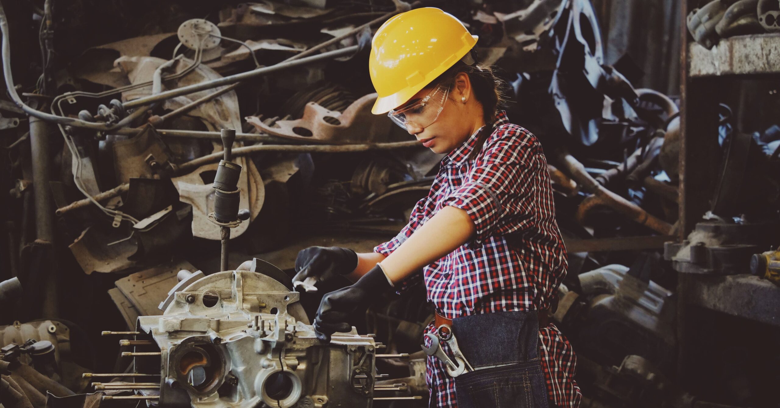 Woman repairing machine