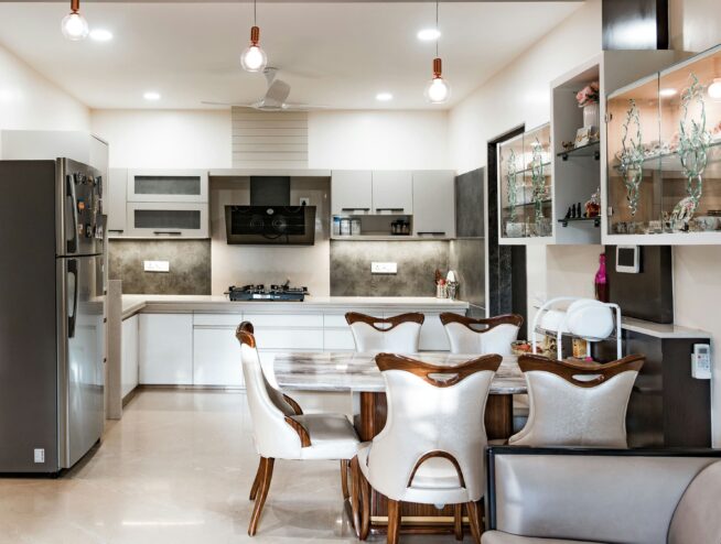 Dinning table, fridge and kitchen