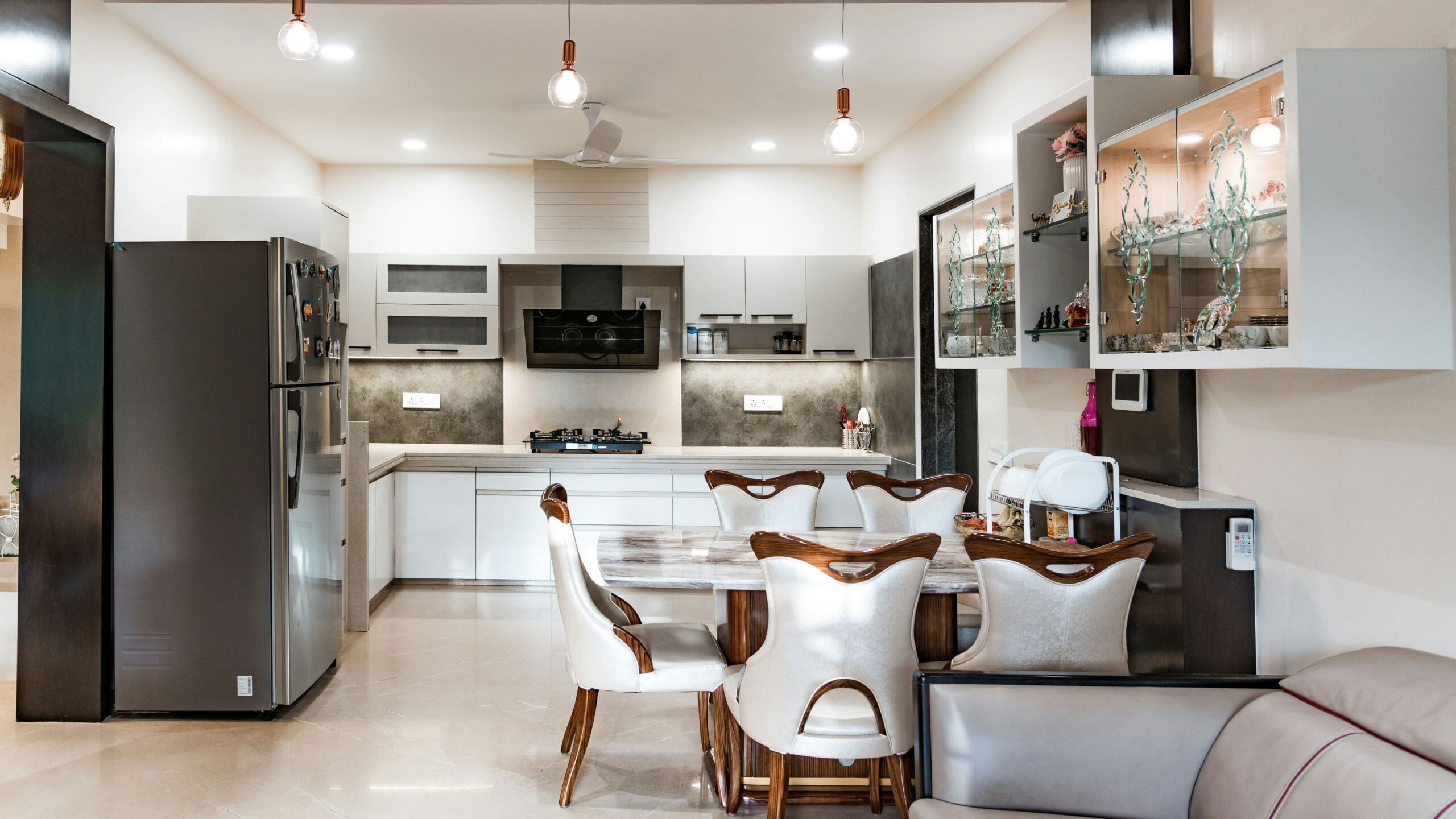 Dinning table, fridge and kitchen